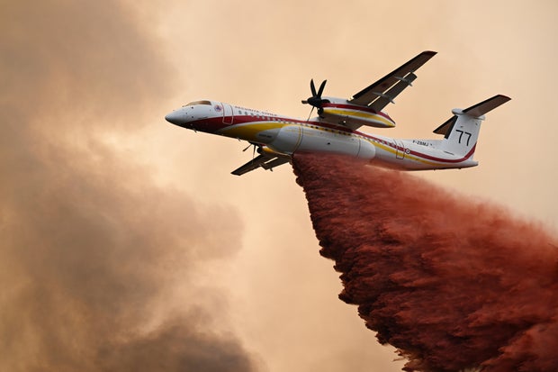 2 firefighters die in Greece as others fight massive blaze in France