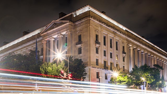 U.S. Department of Justice Headquarters Building at Night 