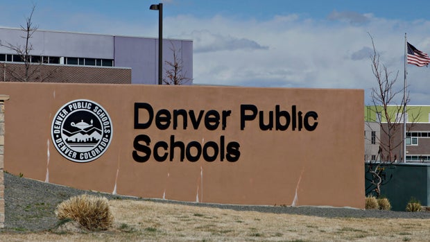 A Denver Public Schools emblem and sign