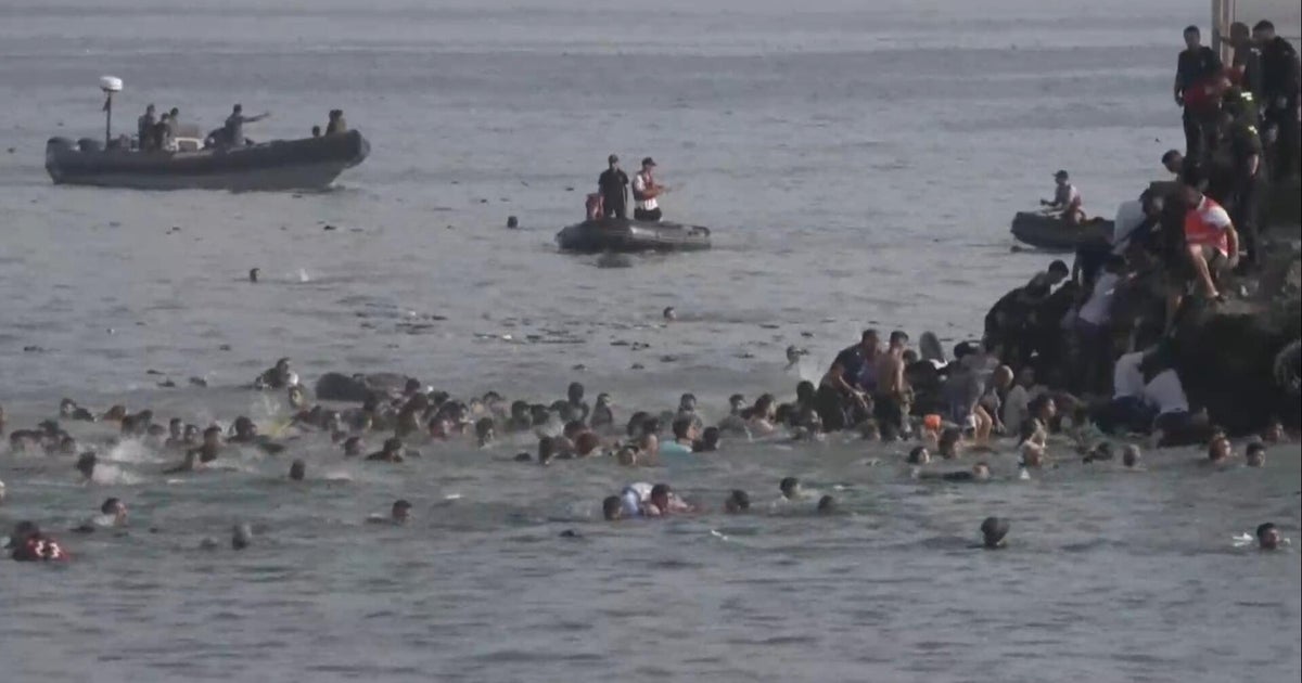 Thousands of migrants cross into Spain’s tiny Ceuta territory, some die in journey
