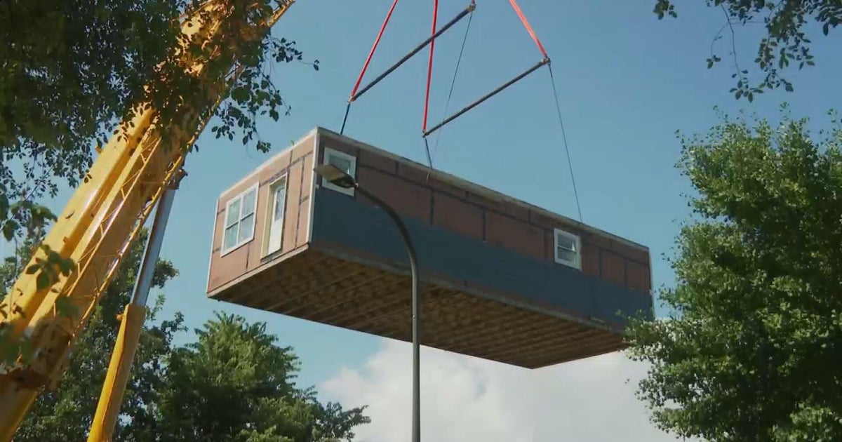 Students from Evanston Township High School move house built as part of course