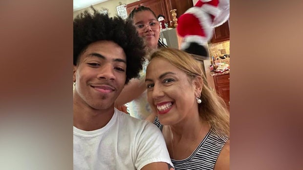 Brandon Garcia with his adoptive mother and sister