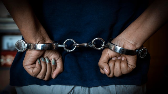 Woman hand with Indian handcuffs 