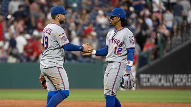 New York Mets' Bo Bichette (19) congratulates Francisco Lindor (12) after a baseball game against the Cleveland Guardians, Wednesday, Aug. 5, 2026, in Cleveland. 