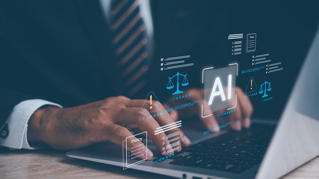 Businessman working on laptop with artificial intelligence law icons showing regulation, ethics and compliance standards, highlighting responsible technology governance and legal risk management 