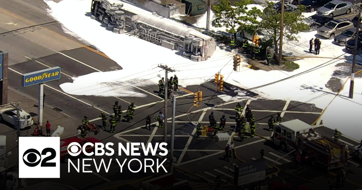 Overturned fuel tanker shuts down Queens road after spill