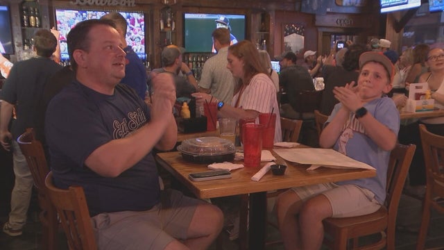 Fans cheer while watching the Little League Baseball World Series 