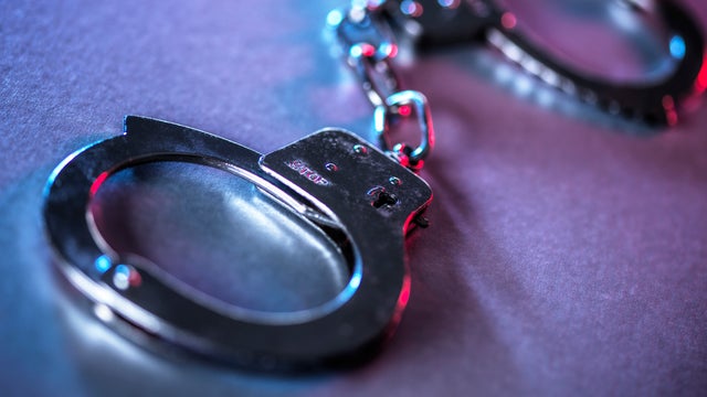 Close-up of metal handcuffs symbolizing justice and crime control 