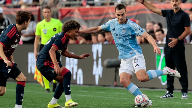 James Sands #6 of the New York City Football Club cuts from Judah Siqueira #65 of the New England Revolution during a match between the New England Revolution and New York City FC on August 23, 2026, at Gillette Stadium in Foxborough, Massachusetts. 