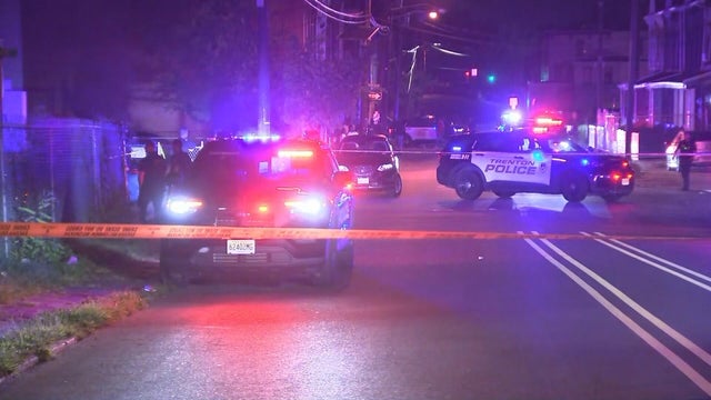 Police cars and police tape at a shooting scene on Locust Street in Trenton, New Jersey 