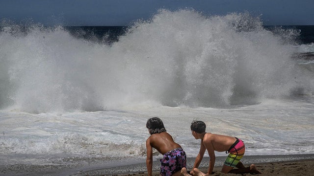Search underway for young girl swept into big surf off Laguna Beach 