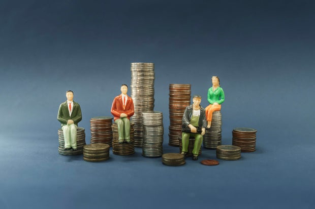 Elderly people sitting on coin, Time counting down for retirement concept, social security income and pensions