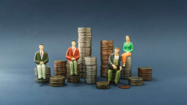 Elderly people sitting on coin, Time counting down for retirement concept, social security income and pensions 