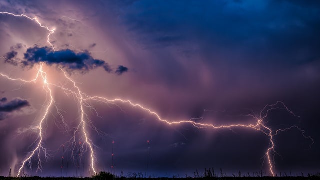 Panoramic view of lightning against sky at night 