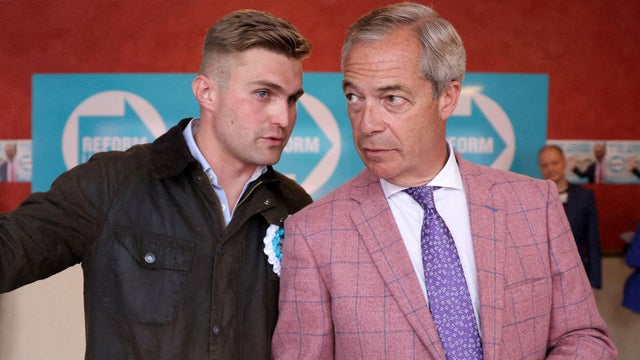 Dan Jukes speaks to UK Reform party leader Nigel Farage in Clacton-on-Sea, Britain, July 2, 2024. 