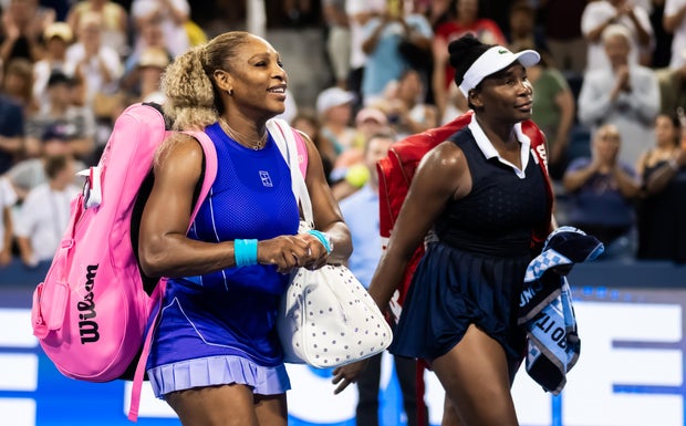 Serena Williams and Venus Williams walk off the court after losing at the Cincinnati Open at Lindner Family Tennis Center on Aug. 17, 2026, in Mason, Ohio.