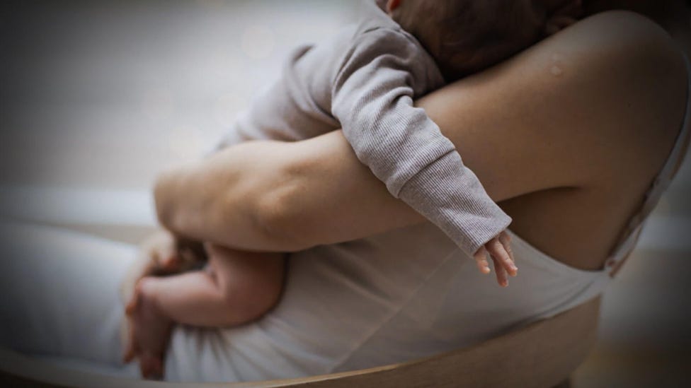 What is postpartum psychosis?