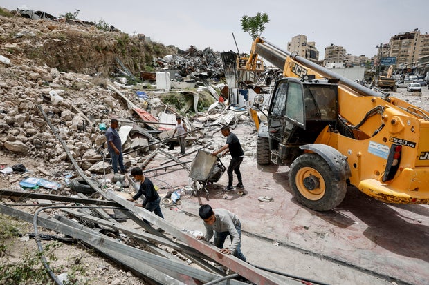 Palestinians demolish their own shops in the West Bank