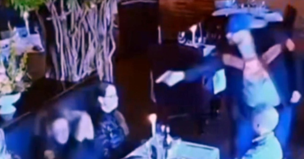 Video shows would-be killer pointing gun at ex-wife before it jams in a crowded restaurant