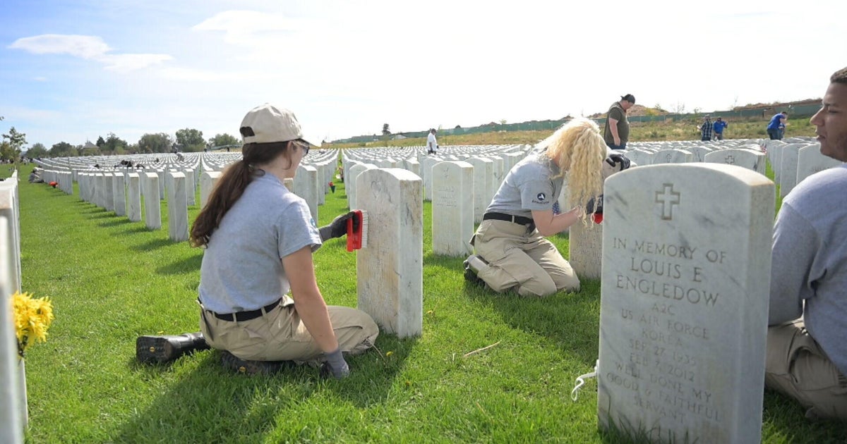 Denver volunteers clean Fort Logan National Cemetery in remembrance of 9/11