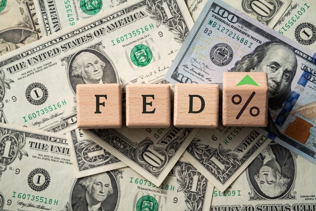 Wooden blocks with interest rate percent of bank with US dollars, financial world economy crisis design concept. 