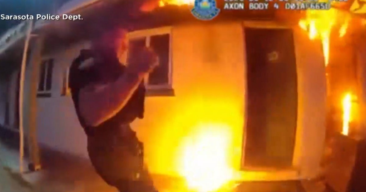 Video shows first responders rushing to flame-engulfed motel, saving lives