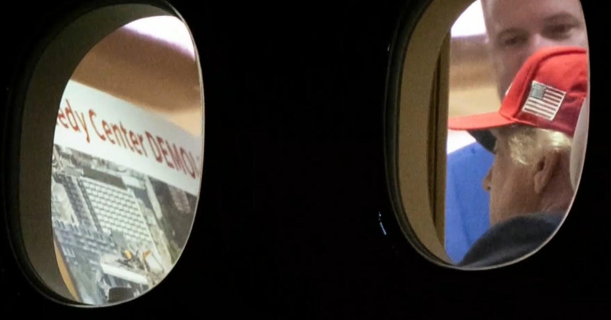 Photo shows Trump viewing pile of rubble under words, "Kennedy Center demolished"