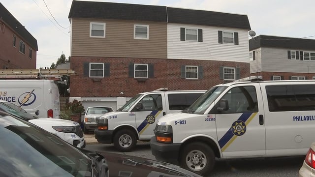 Two sherriff's office vans are outside a home on Colony Drive in Northeast Philadelphia 