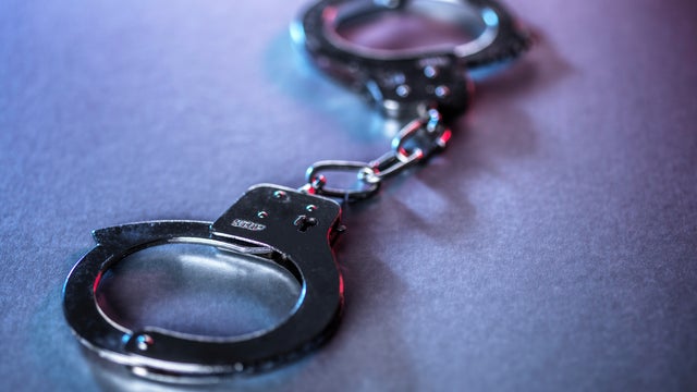 Close-up of metal handcuffs symbolizing justice and crime 