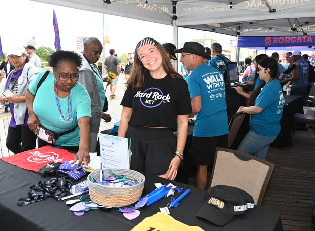People post for photos at the Out of the Darkness Walk on benefiting the American Foundation for Suicide Prevention