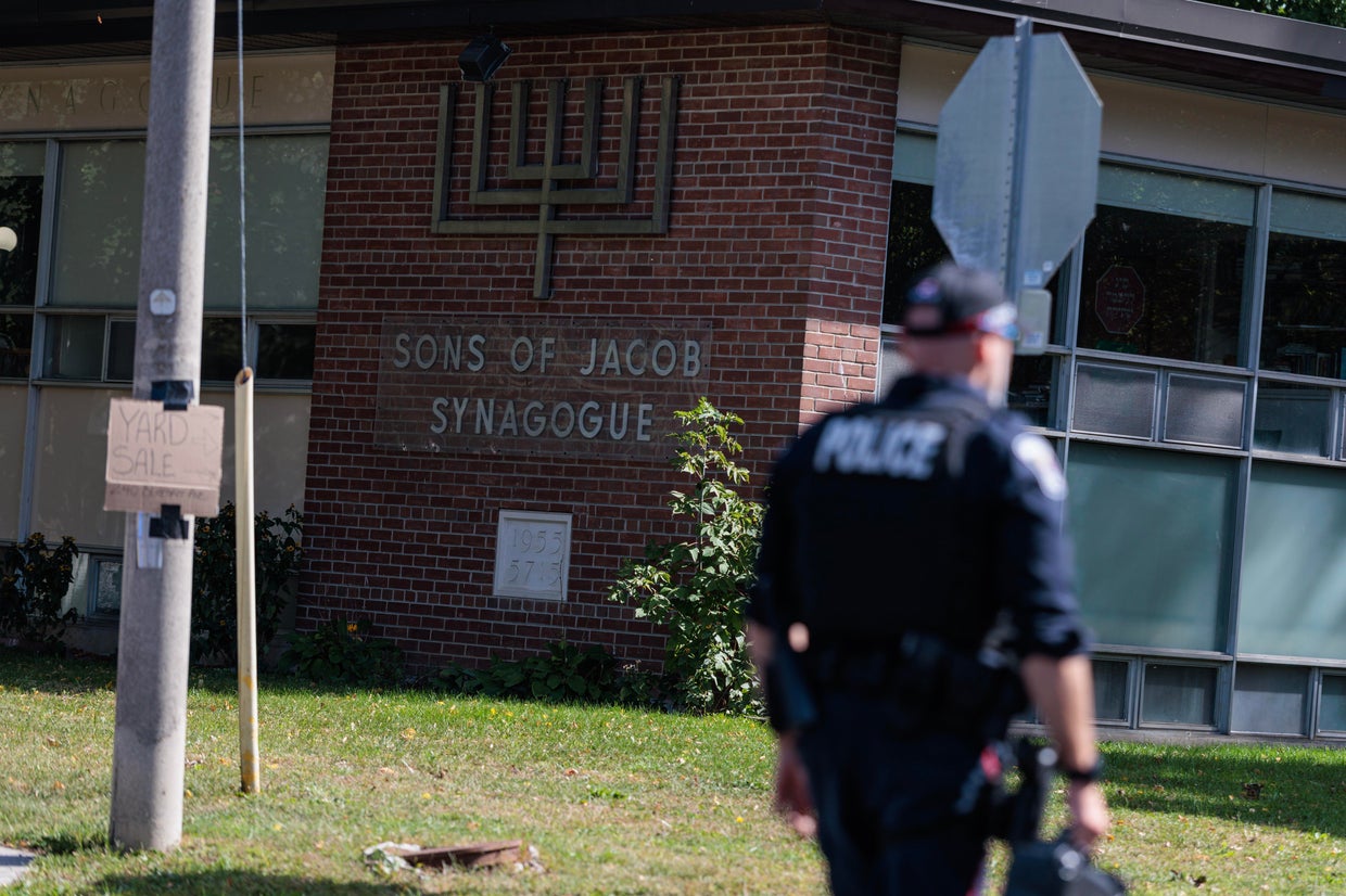 Scene from outside the Sons of Jacob Synagogue where a man armed with a shotgun exchanged gun fire with a police officer stationed outside of the Synagogue late Sunday evening as people were arriving for Yom Kippur. 