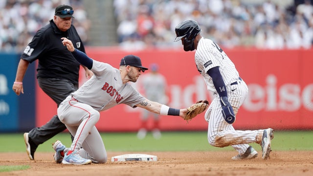 Trevor Story #10 of the Boston Red Sox in action against Amed Rosario #14 of the New York Yankees at Yankee Stadium on August 30, 2026 in New York City. 