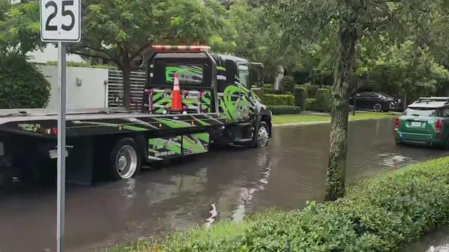 Heavy rain and king tides continuing to soak South Florida roads