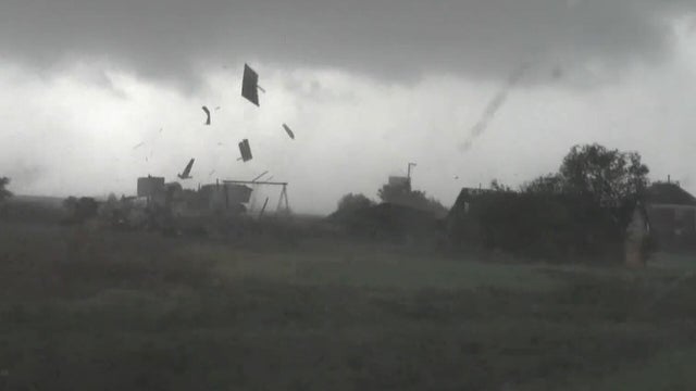 Debris flies around Kansas amid severe storms