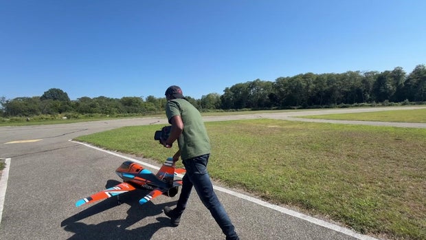 Man with a 7-foot-long miniature plane 
