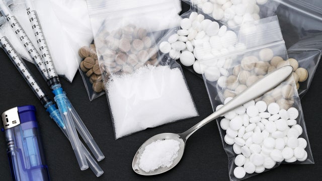 cooked heroin drugs and injection syringe 