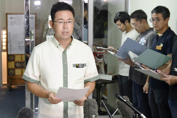 Okinawa Gov. Genta Koja speaks to the media