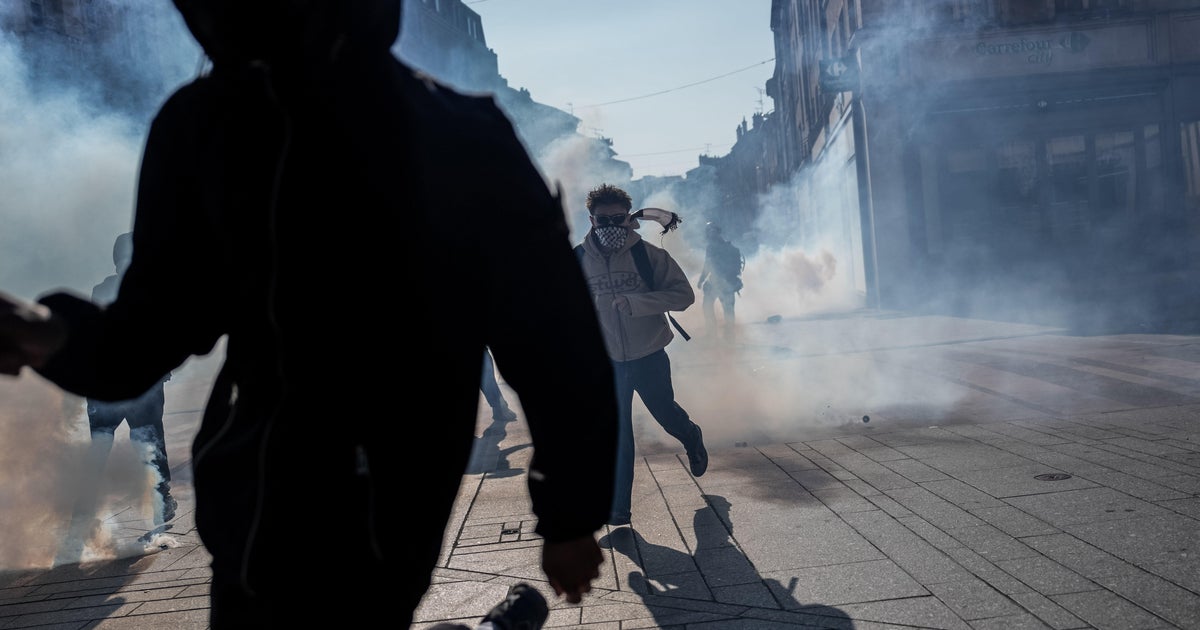 Teenager loses hand picking up grenade in France school protests