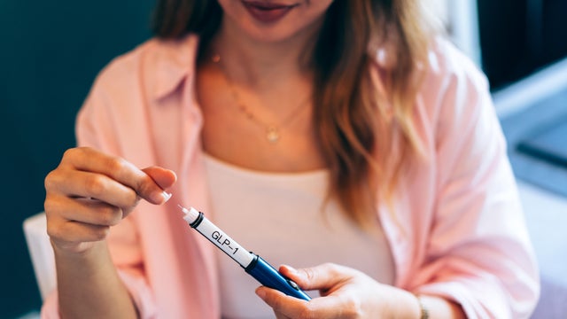 Young Woman Using Peptides Injection at Home 
