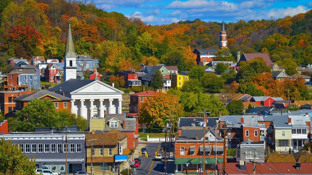 Picturesque mountain town of Cumberland Maryland on a beautiful autumn day with vibrant fall colors and puffy clouds 