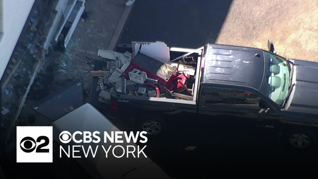 Car slams into New Jersey building