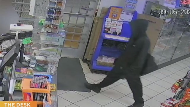 Surveillance video captures Dallas armed robbery suspect taking cash from clerk