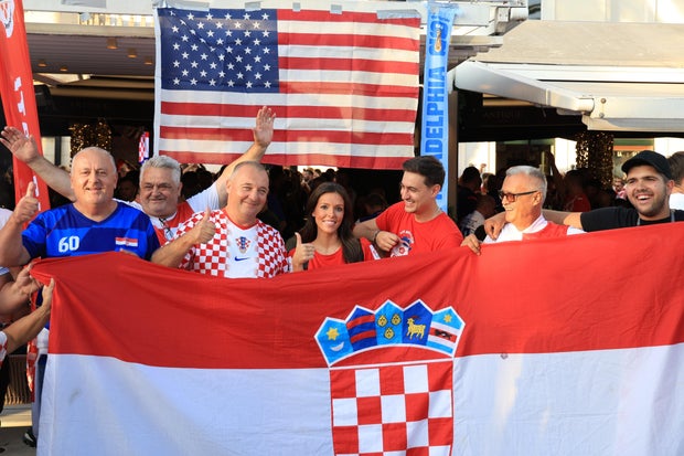 Ashton and Zachary Smith pose with Croatian supporters prior to the Nations League soccer match between Croatia and Spain, in Split, Croatia