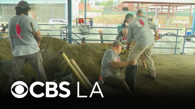 Team Rubicon helps fill and distribute sandbags in Newport Beach ahead of potential flooding