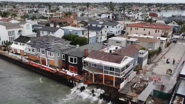 Tropical storm remnants pummel Southern California