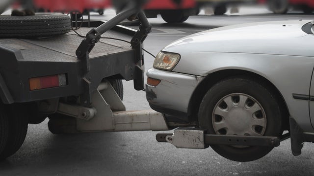 police department tow truck delivers the damaged vehicle 