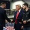 Trump issues pardons to 2 auto shop owners at Alaska rally