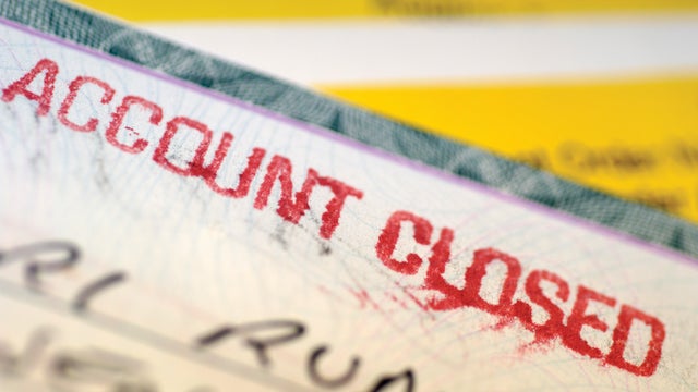 "Check with account closed written on it, close-up" 
