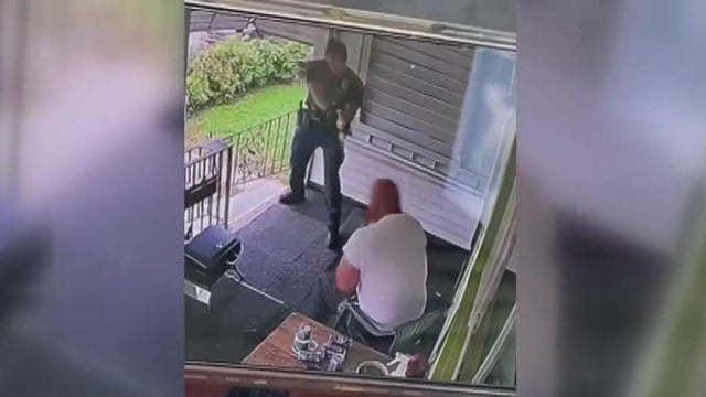 Video shows officer punching and tasing man sitting in chair on porch