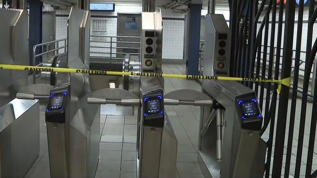 Crime scene tape across turnstiles 